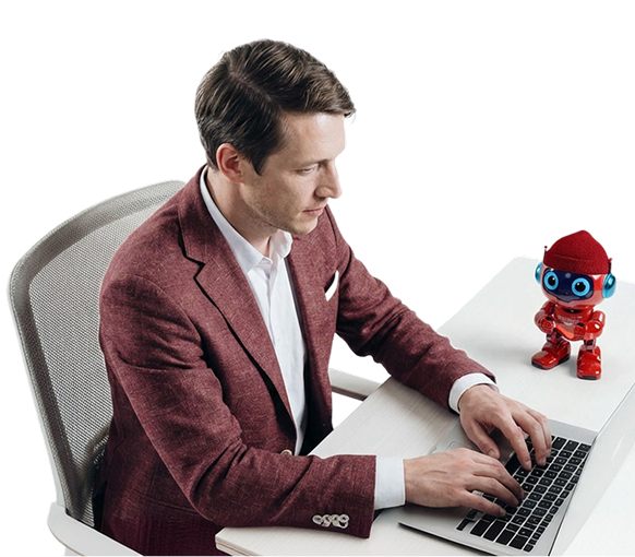 A person working on a laptop next to a small Creatio AI Twin robot